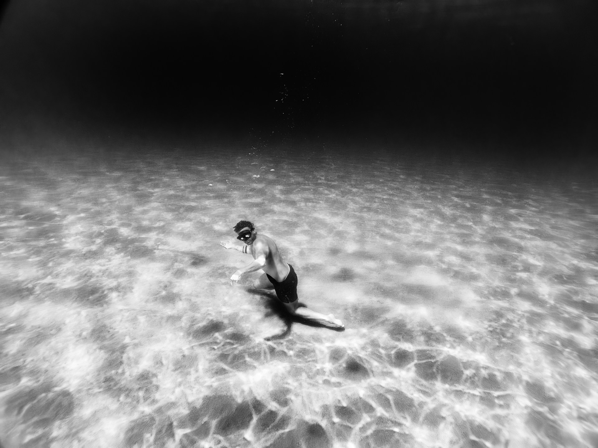 A woman swimming in clear blue water